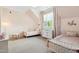 Bright ' bedroom with twin beds, pastel colors, and natural light at 5125 Avalaire Oaks Dr, Raleigh, NC 27614