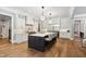 Modern kitchen boasting stainless steel appliances, a large island, and custom cabinetry at 5125 Avalaire Oaks Dr, Raleigh, NC 27614