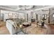 Bright living room features elegant coffered ceiling and open access to kitchen and foyer at 5125 Avalaire Oaks Dr, Raleigh, NC 27614