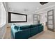 Home movie room with large screen, plush seating, and custom built-in storage at 5125 Avalaire Oaks Dr, Raleigh, NC 27614