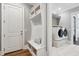 Well-organized mud room with built-in bench, storage, and convenient access to laundry area at 5125 Avalaire Oaks Dr, Raleigh, NC 27614