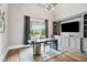 Home office features custom built-ins, modern desk, and a large window with a beautiful view at 5125 Avalaire Oaks Dr, Raleigh, NC 27614