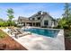Relaxing backyard pool featuring fountains, tanning ledges and comfortable lounge chairs for soaking up the sun at 5125 Avalaire Oaks Dr, Raleigh, NC 27614