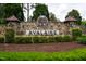 A stone entrance sign reading 'AVALAIRE' surrounded by manicured hedges, inviting you into the community at 5125 Avalaire Oaks Dr, Raleigh, NC 27614
