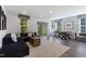 Spacious basement featuring a comfortable seating area, a recreational area with foosball, and natural light through windows at 5906 Dunzo Dr, Raleigh, NC 27617
