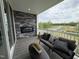Relaxing outdoor patio featuring a stone fireplace, cozy seating, and a scenic view of the surrounding landscape at 5906 Dunzo Dr, Raleigh, NC 27617