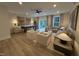 Entertainment space featuring a shuffleboard table, stylish seating, and a patio entrance at 5906 Dunzo Dr, Raleigh, NC 27617