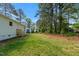 Large backyard with new back porch and access to additional outdoor buildings at 623 Lincoln Dr, Kenly, NC 27542