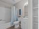 Bright bathroom features a shower-tub combo, white vanity, and coastal-themed decor at 623 Lincoln Dr, Kenly, NC 27542