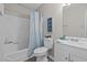 Bright bathroom with tub and shower combination, a white sink and cabinet with a modern design at 623 Lincoln Dr, Kenly, NC 27542
