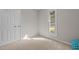 Comfortable bedroom with a window view, neutral carpet and nearby closet at 623 Lincoln Dr, Kenly, NC 27542