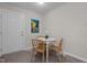 Cozy dining area with a round table, wicker chairs, and modern laminate flooring at 623 Lincoln Dr, Kenly, NC 27542
