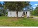 Charming, well-maintained house featuring vinyl siding, new front steps, and a lovely landscaped yard at 623 Lincoln Dr, Kenly, NC 27542
