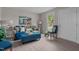 Cozy living room featuring modern laminate flooring, stylish furniture, and ample natural light at 623 Lincoln Dr, Kenly, NC 27542