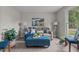 Cozy living room with modern laminate flooring, neutral wall paint and comfortable furniture at 623 Lincoln Dr, Kenly, NC 27542