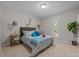 Serene bedroom features a plush bed, two side tables and bright natural light at 623 Lincoln Dr, Kenly, NC 27542
