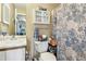 This bathroom includes a vanity, toilet, and a shower with a decorative blue and white patterned curtain at 700 Martin Luther King Jr Blvd # A6, Chapel Hill, NC 27514