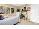 This cozy bedroom features neutral walls, posters, and a convenient desk area for work or studying at 700 Martin Luther King Jr Blvd # A6, Chapel Hill, NC 27514