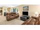 Well-decorated living room featuring leather sofas, large windows, and a modern TV at 700 Martin Luther King Jr Blvd # A6, Chapel Hill, NC 27514