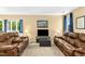 Inviting living room with dual leather sofas, a media center and ample natural light at 700 Martin Luther King Jr Blvd # A6, Chapel Hill, NC 27514