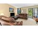 Comfortable living room with cozy seating, a TV, and a sliding door to the balcony at 700 Martin Luther King Jr Blvd # A6, Chapel Hill, NC 27514