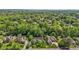 Scenic aerial view of lush neighborhood with mature trees and well-manicured lawns in a desirable community at 708 Mill Pointe Way, Elon, NC 27244