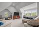 Bright and airy bonus room with window seats, carpeted floors, and neutral paint at 708 Mill Pointe Way, Elon, NC 27244