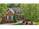 Charming brick home with inviting front porch and landscaped yard at 708 Mill Pointe Way, Elon, NC 27244