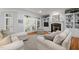 Cozy living room featuring a fireplace, built-in shelving, and French doors leading to the outside at 708 Mill Pointe Way, Elon, NC 27244