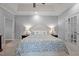 View of the large main bedroom with carpet floors, base molding and doors leading to a private balcony at 708 Mill Pointe Way, Elon, NC 27244