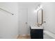 Modern bathroom featuring gold fixtures, new vanity and marble countertop at 8004 Mill Bluff Ct, Raleigh, NC 27616