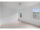 Bright bedroom with large windows and neutral carpet at 8004 Mill Bluff Ct, Raleigh, NC 27616