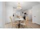Bright breakfast area features modern chandelier and access to updated kitchen at 8004 Mill Bluff Ct, Raleigh, NC 27616