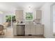 Bright, functional kitchen area with modern cabinets, stainless steel appliances, and deck access at 8004 Mill Bluff Ct, Raleigh, NC 27616
