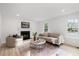 Inviting living room with fireplace, neutral decor, and natural light at 8004 Mill Bluff Ct, Raleigh, NC 27616