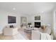 Bright, spacious living room with fireplace, plush seating, and hardwood floors at 8004 Mill Bluff Ct, Raleigh, NC 27616