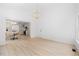 Bright living room with hardwood floors and modern lighting opens to the kitchen at 8004 Mill Bluff Ct, Raleigh, NC 27616
