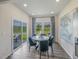 Cozy dining area with a round table, comfortable seating, and natural light from the sliding glass door at 805 Ottawa Dr, Garner, NC 27529
