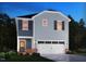Charming two-story home with a two-car garage, stylish shutters, and a cozy front porch at 805 Ottawa Dr, Garner, NC 27529