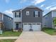 Two-story home with a two-car garage and a well-manicured lawn at 805 Ottawa Dr, Garner, NC 27529