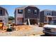 New two-story home under construction with dark siding and a two-car garage ready for customization at 805 Ottawa Dr, Garner, NC 27529