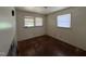 Bedroom with two windows and hardwood floors at 829 Coleman St, Raleigh, NC 27610