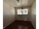 Cozy bedroom features hardwood floors and window with blinds letting in natural light at 829 Coleman St, Raleigh, NC 27610