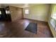 Living room with wood paneling and hardwood floors at 829 Coleman St, Raleigh, NC 27610