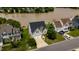 Aerial view of a charming home with a view of the lake and well-maintained landscaping at 1003 Southshore Pkwy, Durham, NC 27703