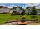The backyard has a deck, a pier, and beautiful landscaping with green grass leading up to the water at 1003 Southshore Pkwy, Durham, NC 27703