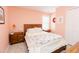 Well-lit bedroom with a cozy bed, wooden furniture, and decorative accents at 1003 Southshore Pkwy, Durham, NC 27703
