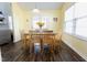 Bright dining room with natural light and a table set for six at 1003 Southshore Pkwy, Durham, NC 27703