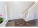 Foyer featuring hardwood floors, wainscoting, and a staircase with carpeted steps and white risers at 1003 Southshore Pkwy, Durham, NC 27703