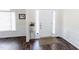 Foyer featuring hardwood floors, wainscoting, and a white front door with sidelights at 1003 Southshore Pkwy, Durham, NC 27703